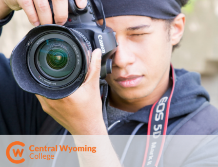 A student taking a photo with a canon camera