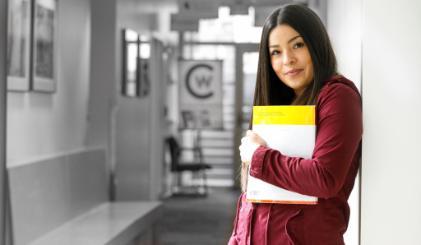 A student standing in a hallway at CWC Jackson