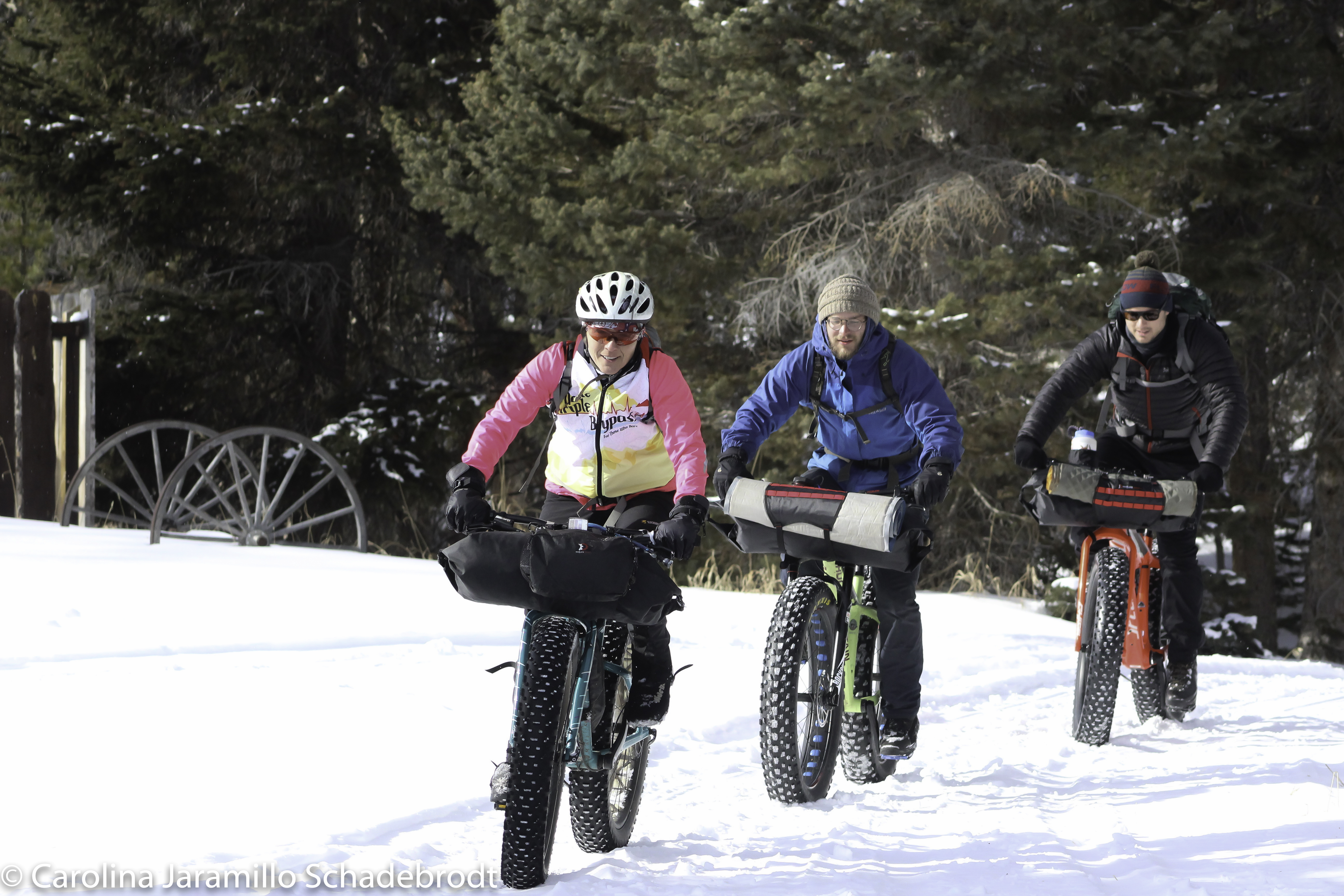 Students riding bikes in the snow