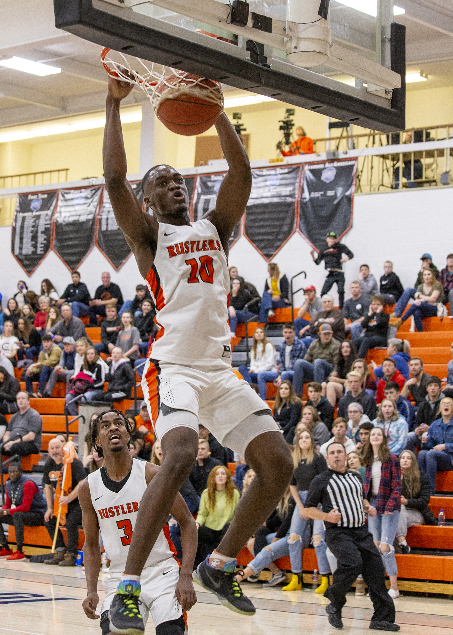 CWC men's player dunking the basketball