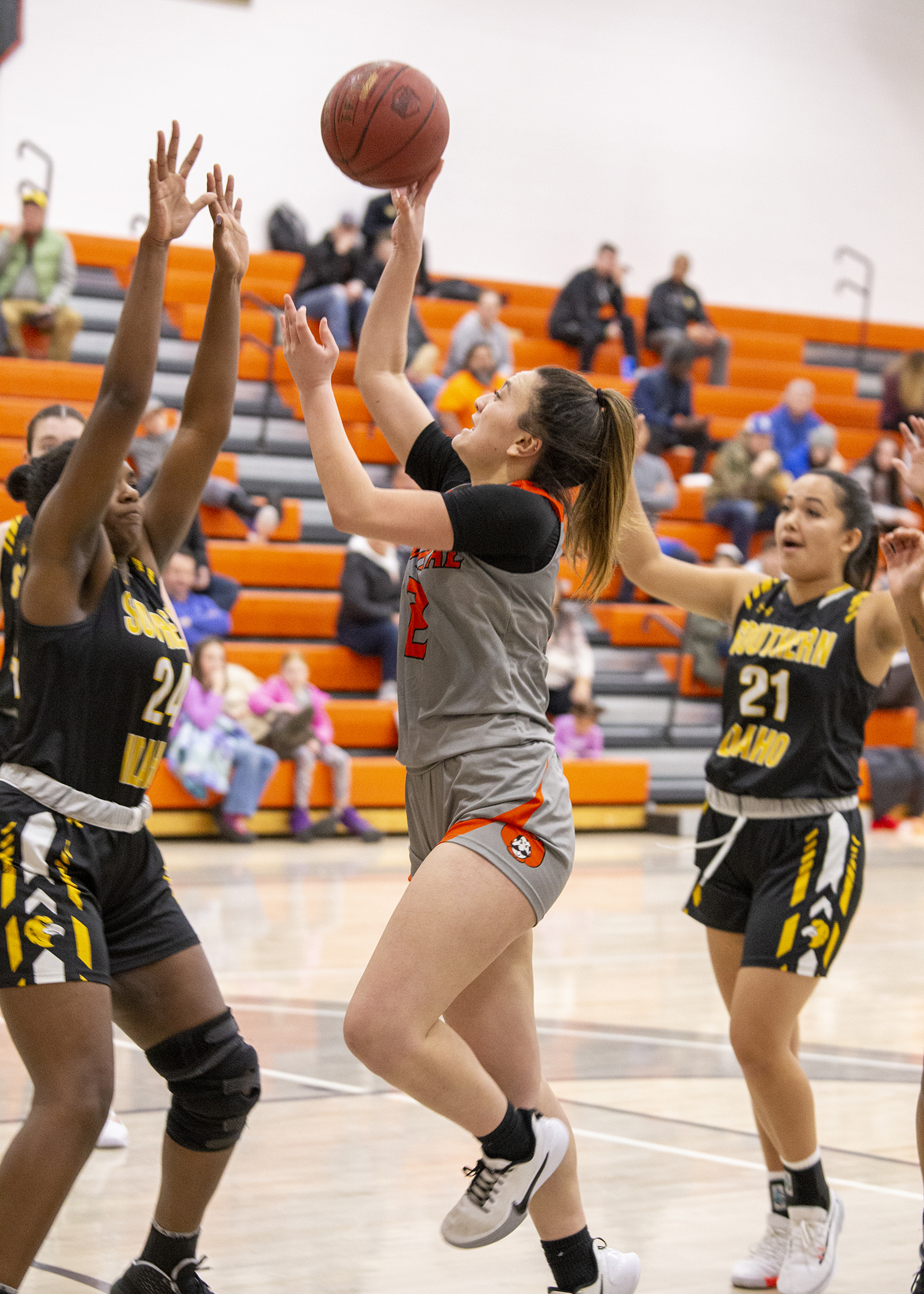 Women's basketball player goes up for a shot