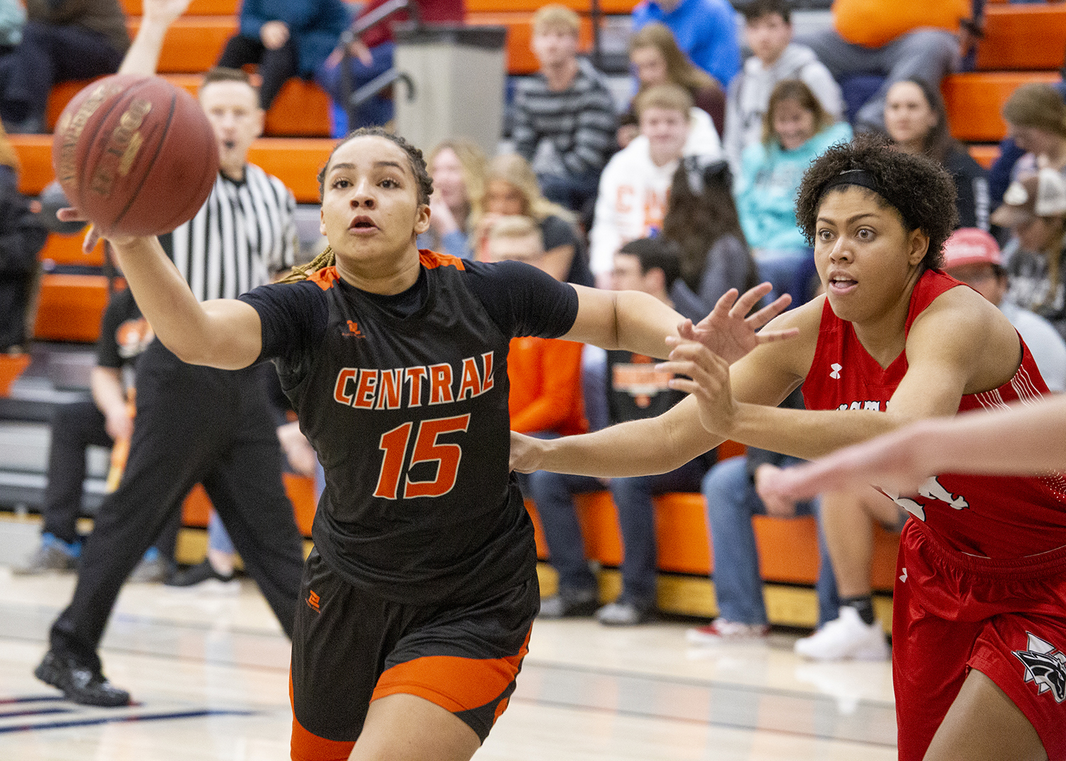 CWC women's basketball player defending the ball from their opponent