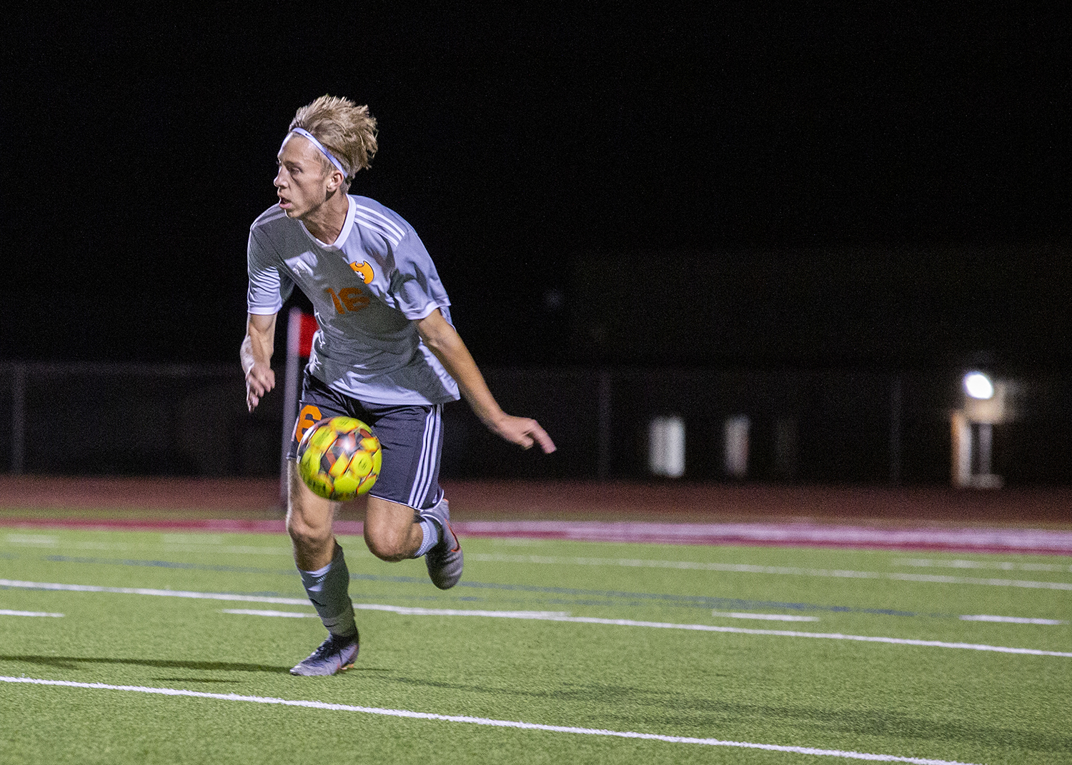 men's soccer player kicks the ball