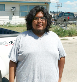 photo of male student standing outside