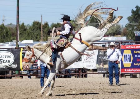 CWC cowboy Brady Thurston on bucking horse in the saddle bronc event