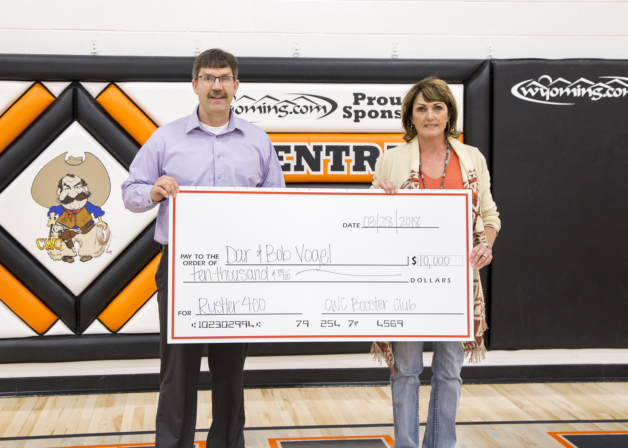 CWC Steve Barlow presents Rustler 400 winner Dar Vogel with a giant check for $10,000