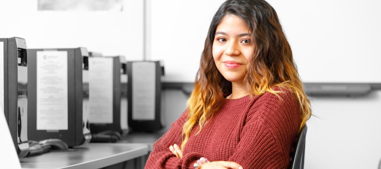 Misty Vincente is a student at CWC. She sits in front of a computer.