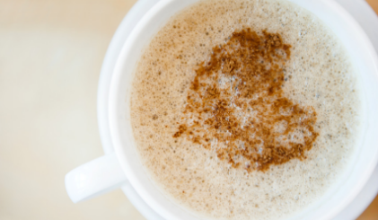 A latte with a heart in the foam.